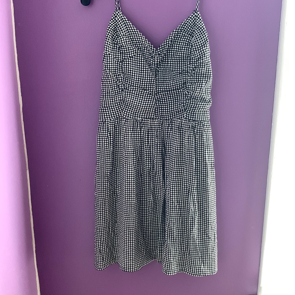 We have a very pretty and comfortable checkered Dress. White and Black design.